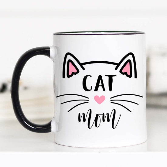 11 ounce mug black hand and rim. "Cat Mom" Cat ears and whiskers. 